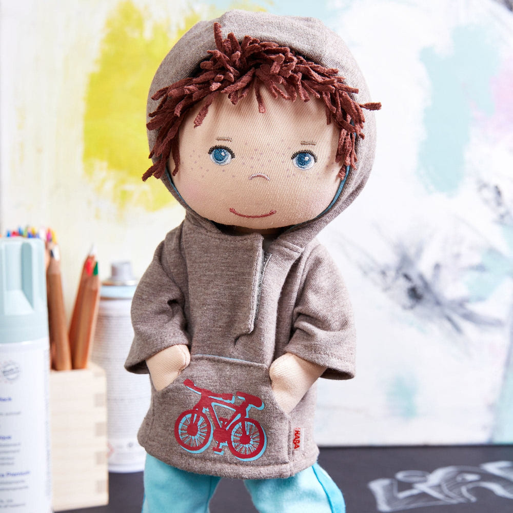 Soft doll Lian in a cozy hoodie, perfect for cuddles and imaginative play. Ideal gift for babies and toddlers.