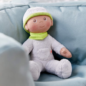 Snug Up Doll Ollie in a cozy pose, perfect for cuddly moments and imaginative play for babies and toddlers.
