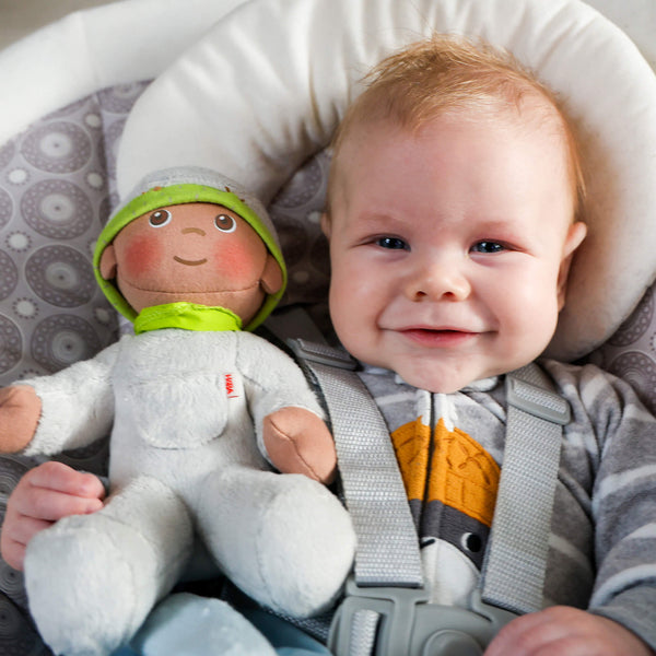 Snug Up Doll Ollie in a cozy pose, perfect for cuddling and comforting babies.