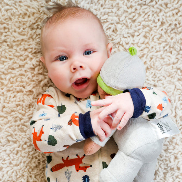 Snug Up Doll Ollie in a cozy pose, perfect for comforting babies and toddlers.