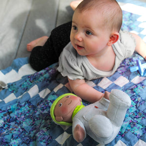 Snug Up Doll Ollie in a cozy pose, perfect for cuddles and comfort for your little one.