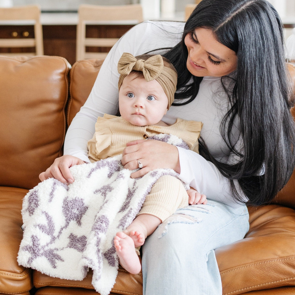 Double-layer Bamboni® mini blankets for babies, perfect for swaddling and keeping little ones cozy.