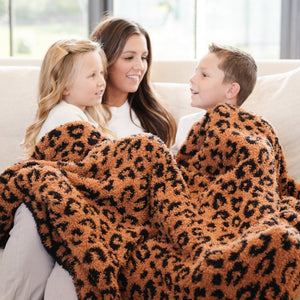 Double-layer Bamboni® throw blankets for babies, cozy and stylish, angled view showcasing soft fabric and design.