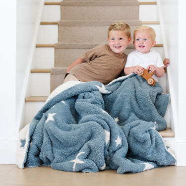 Double-layer Bamboni® toddler blankets for cozy swaddling and comfort, perfect for babies and toddlers.