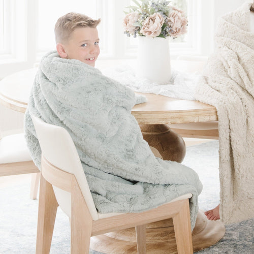 Cozy DREAM TODDLER BLANKETS in vibrant colors, perfect for nurturing comfort and creativity in young learners.