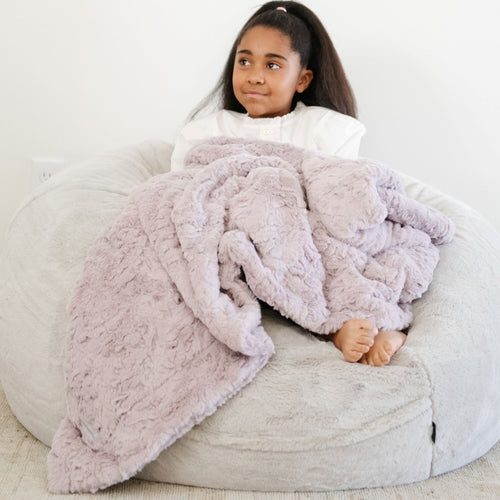 Cozy DREAM TODDLER BLANKETS in vibrant colors, perfect for comfort and learning during playtime.