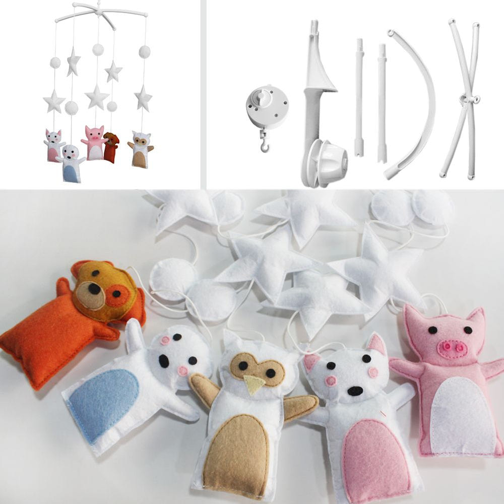 Handmade cute pig dog baby crib mobile for nursery decor, featuring musical elements for kids' rooms.