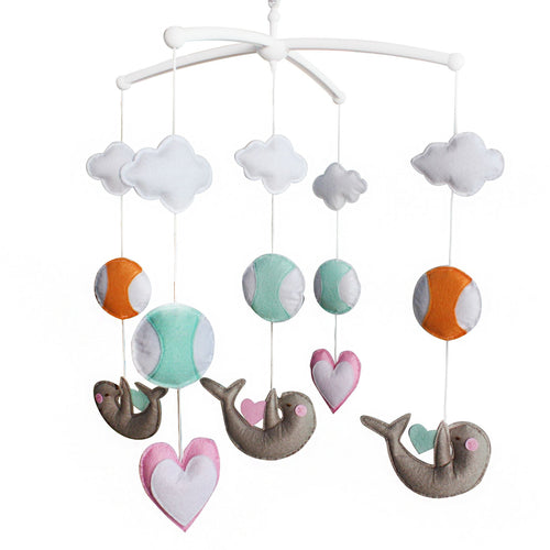 "Musical baby crib mobile featuring a lovely beaver playing with balls, perfect nursery decor for infants."