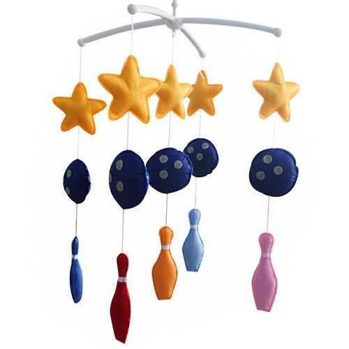 Handmade bowling baby crib mobile, musical nursery decor for boys and girls, perfect for a charming nursery.