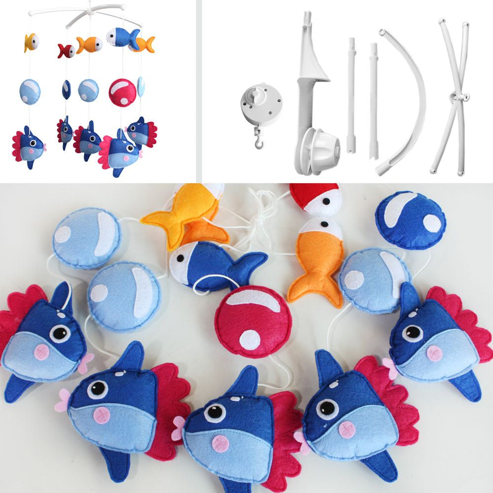 Marine fish crib mobile in blue ocean theme for nursery decor, perfect for baby boys and girls.