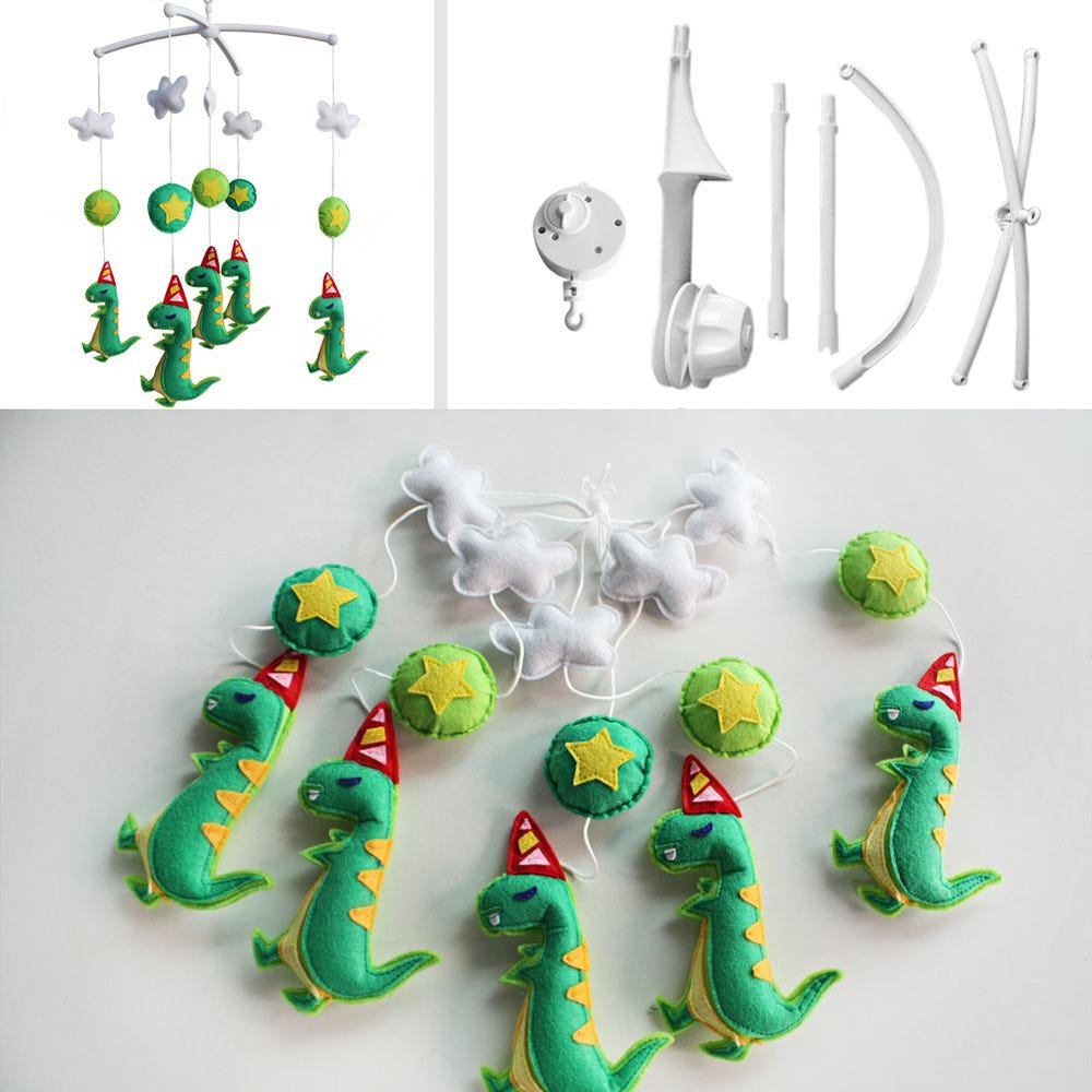 Handmade green dinosaur musical mobile for baby crib, perfect nursery decor and baby shower gift.
