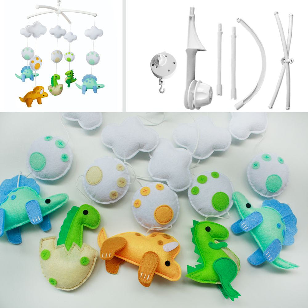 Handmade baby crib musical mobile with colorful dinosaur design for nursery decor and baby shower gift.
