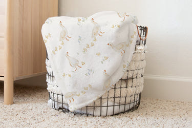 Vintage baby blanket featuring adorable baby ducks and chicks design. Perfect for cozying up your little one.