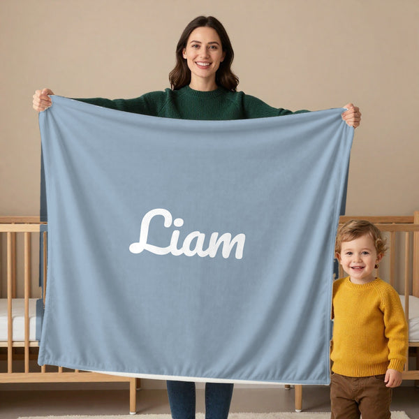Classic Name toddler minky blanket in dusty blue, held by a mom