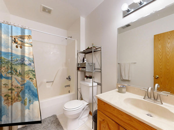 World Explorer shower curtain on a tub shower combo in an American family bathroom
