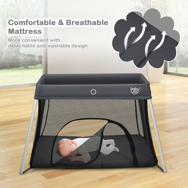 Lightweight foldable baby playpen with carry bag, angled view showcasing its compact design for easy transport.