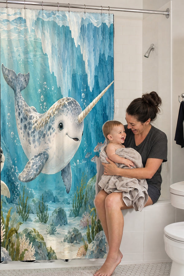 Mom holding her baby on the tub edge next to the Baby Narwhal Ocean shower curtain