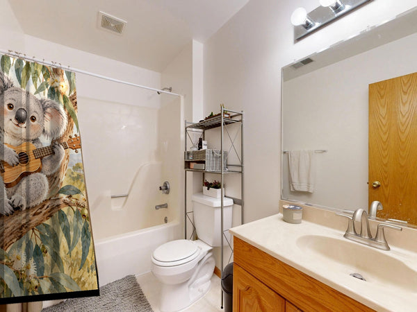 Koala Ukulele shower curtain on a tub shower combo in an American family bathroom