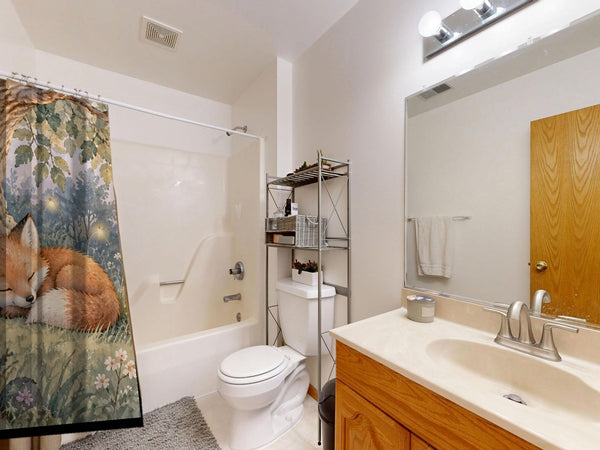 Sleepy Fox shower curtain on a tub shower combo in an American family bathroom