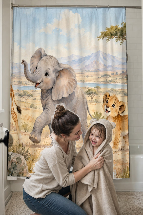 Mom drying her toddler in a hooded towel in front of the Safari Parade shower curtain