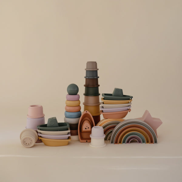Colorful Rainbow Stacker Toy for babies, showcasing vibrant rings at a 30-degree angle. Perfect for sensory play and development.