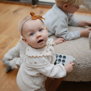 Colorful phone press toy for babies, promoting sensory play and motor skills development. Angle view 10.