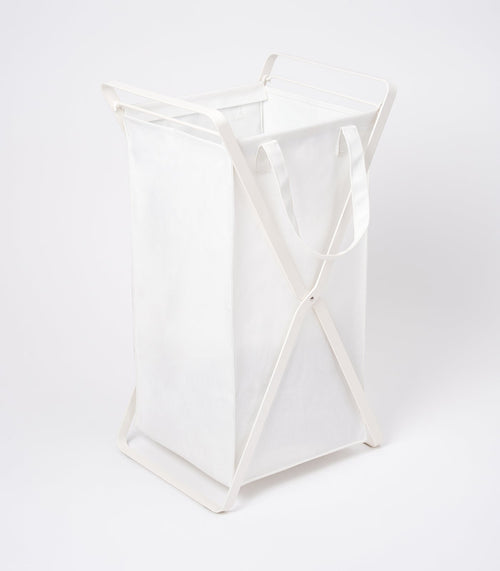 Laundry hamper with cotton liner in two sizes, made of steel and cotton, ideal for organizing baby laundry.