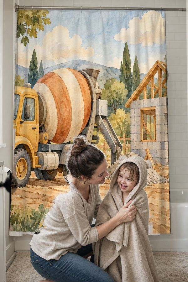 Mom drying her toddler in a hooded towel in front of the Cement Mixer shower curtain