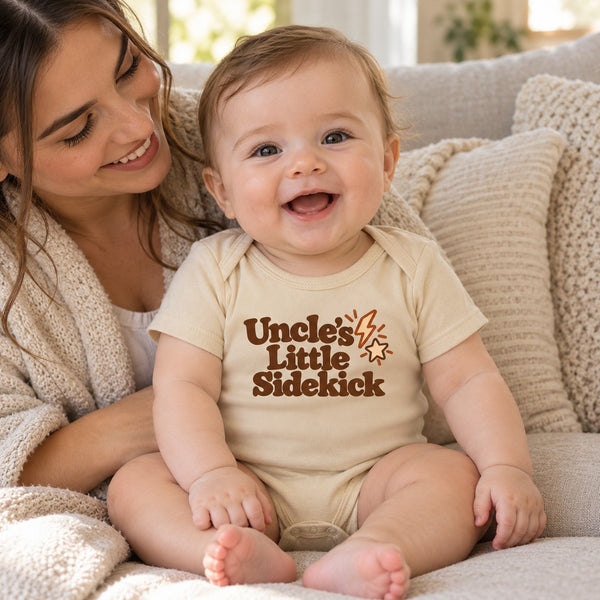 Baby wearing the Uncle's Little Sidekick baby bodysuit