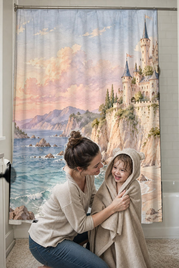 Mom drying her toddler in a hooded towel in front of the Seaside Castle Fairy Tale shower curtain