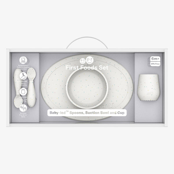 "First Foods Set for babies, featuring colorful bowls and utensils, perfect for introducing solid foods."