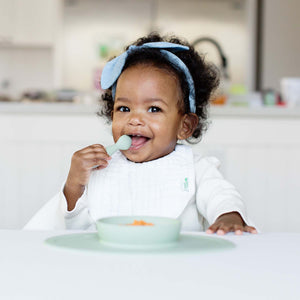 Baby-Led™ Tiny Spoons in a 30-degree angle, perfect for encouraging self-feeding in infants.