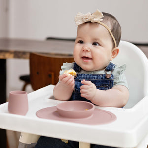 "First Foods Set for babies, featuring colorful bowls and utensils at a 35-degree angle."