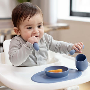 "First Foods Set for babies, featuring colorful bowls and utensils, angled view showcasing essential mealtime accessories."