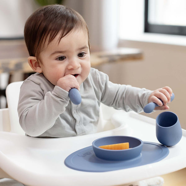 "First Foods Set for babies, featuring colorful bowls and utensils, angled view showcasing essential mealtime accessories."