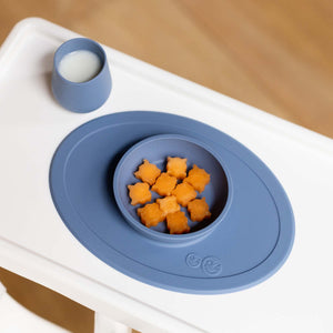 "First Foods Set for babies, featuring colorful utensils and bowls, perfect for introducing solid foods at mealtime."