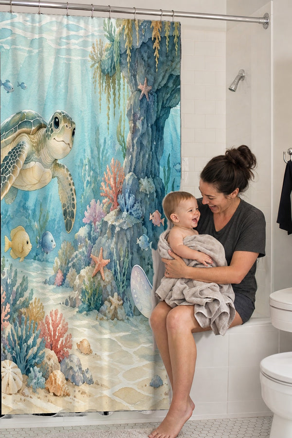 Mom holding her baby on the tub edge next to the Treasure Cove Ocean shower curtain