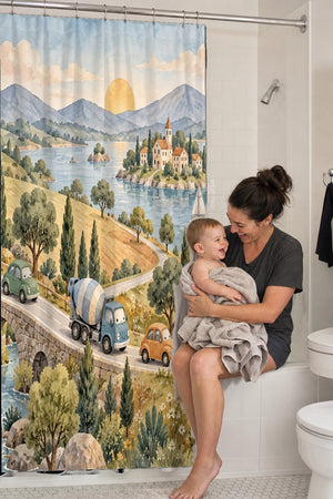 Mom holding her baby on the tub edge next to the Vehicle Parade shower curtain
