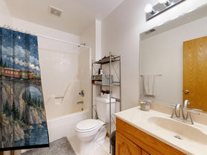Moonlit Train shower curtain on a tub shower combo in an American family bathroom