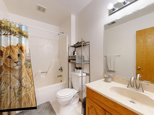 Lion Cub Safari shower curtain on a tub shower combo in an American family bathroom
