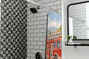 Fire Truck Town shower curtain in a modern farmhouse bathroom with subway tile