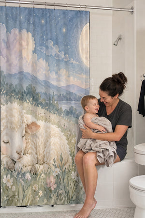 Mom holding her baby on the tub edge next to the Meadow Lamb shower curtain