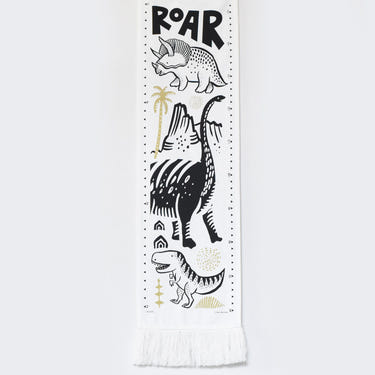 Canvas growth chart featuring colorful dinosaurs, perfect decor for a child's room.