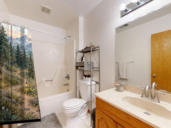 Mountain Camp Camping shower curtain on a tub shower combo in an American family bathroom