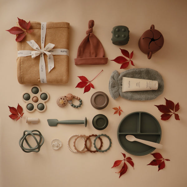 Colorful flower press toy for babies, designed for sensory play and fine motor skill development. Angle 18 view.