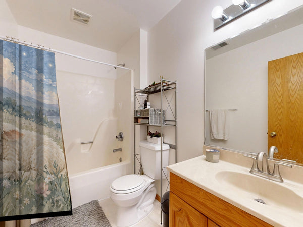 Meadow Lamb shower curtain on a tub shower combo in an American family bathroom