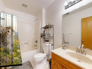 C is for Cat Alphabet shower curtain on a tub shower combo in an American family bathroom