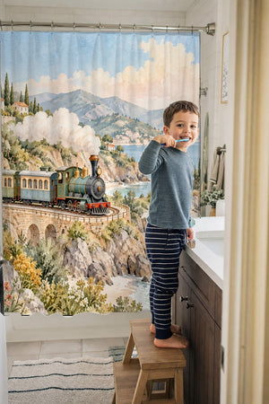Child brushing teeth in a family bathroom with the Coastal Train shower curtain