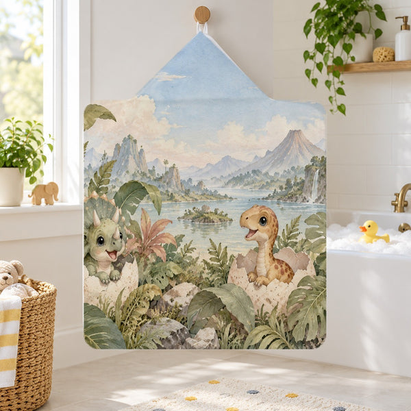 Hatching Dinosaurs kids hooded bath towel hanging in a kids bathroom