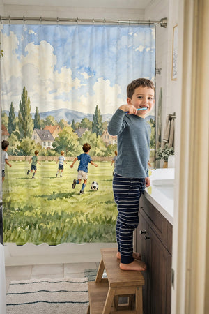 Child brushing teeth in a family bathroom with the Kids Playing Soccer shower curtain